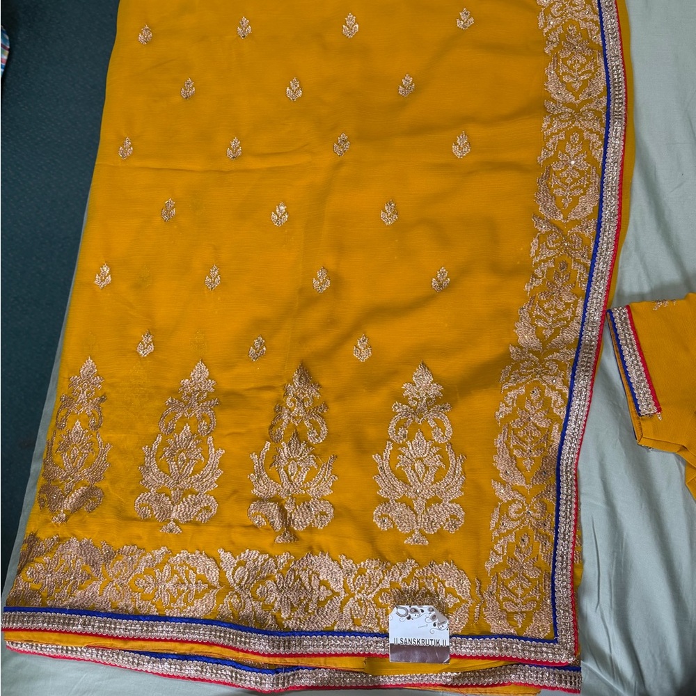 Elegant Mustard Yellow Saree with Intricate Gold Embroidery